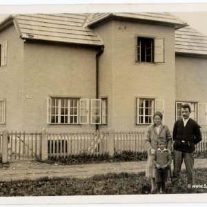 Hausbesitzer und Familienportrait
