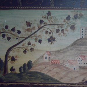 Landschaft darstellend ein Bergdorf mit Wanderer und einer Kirche ohne Dach