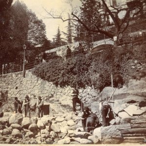 Italian workman repairing river damm