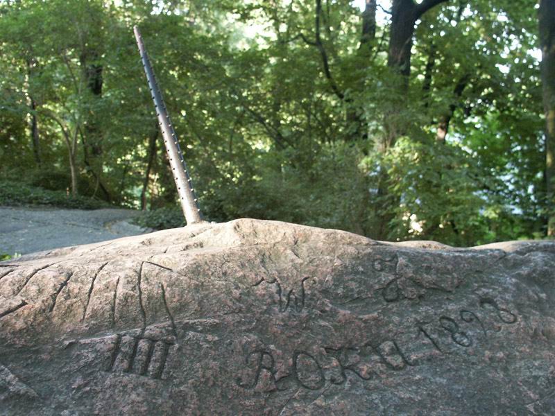 Poland, Warsaw, Lazienki Park, on a rock